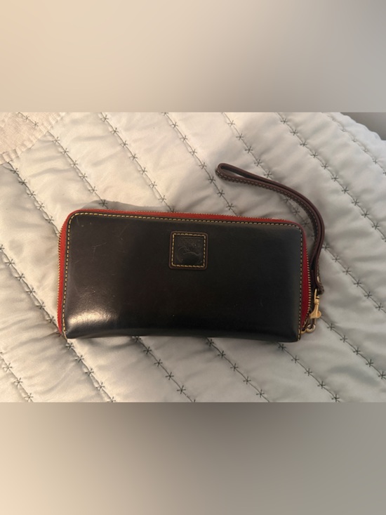 Dooney & Bourke Handbags - Dooney & Bourke Black Leather Zip Wallet with Red Trim